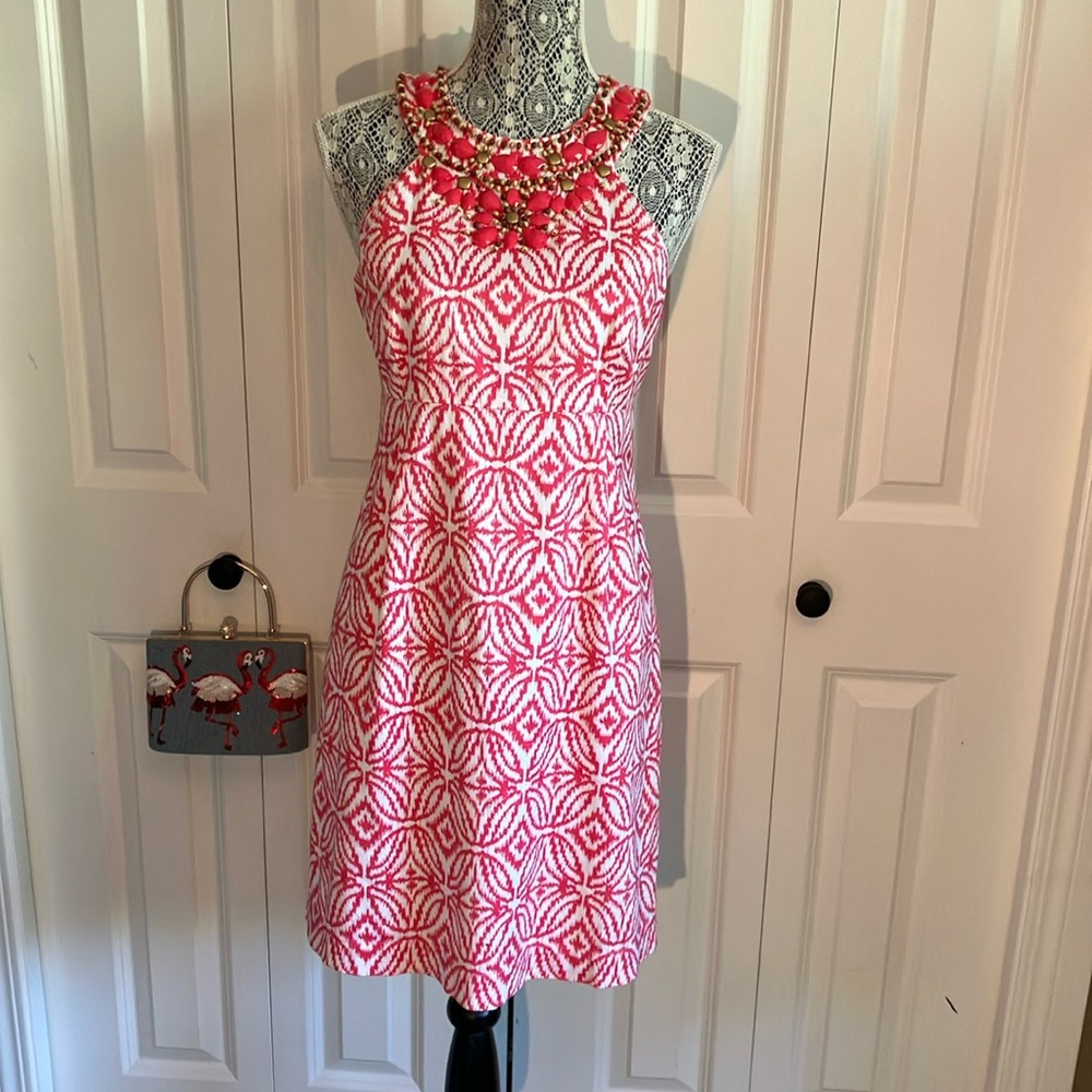 Super cute pink and white print dress with bead detail around neckline.